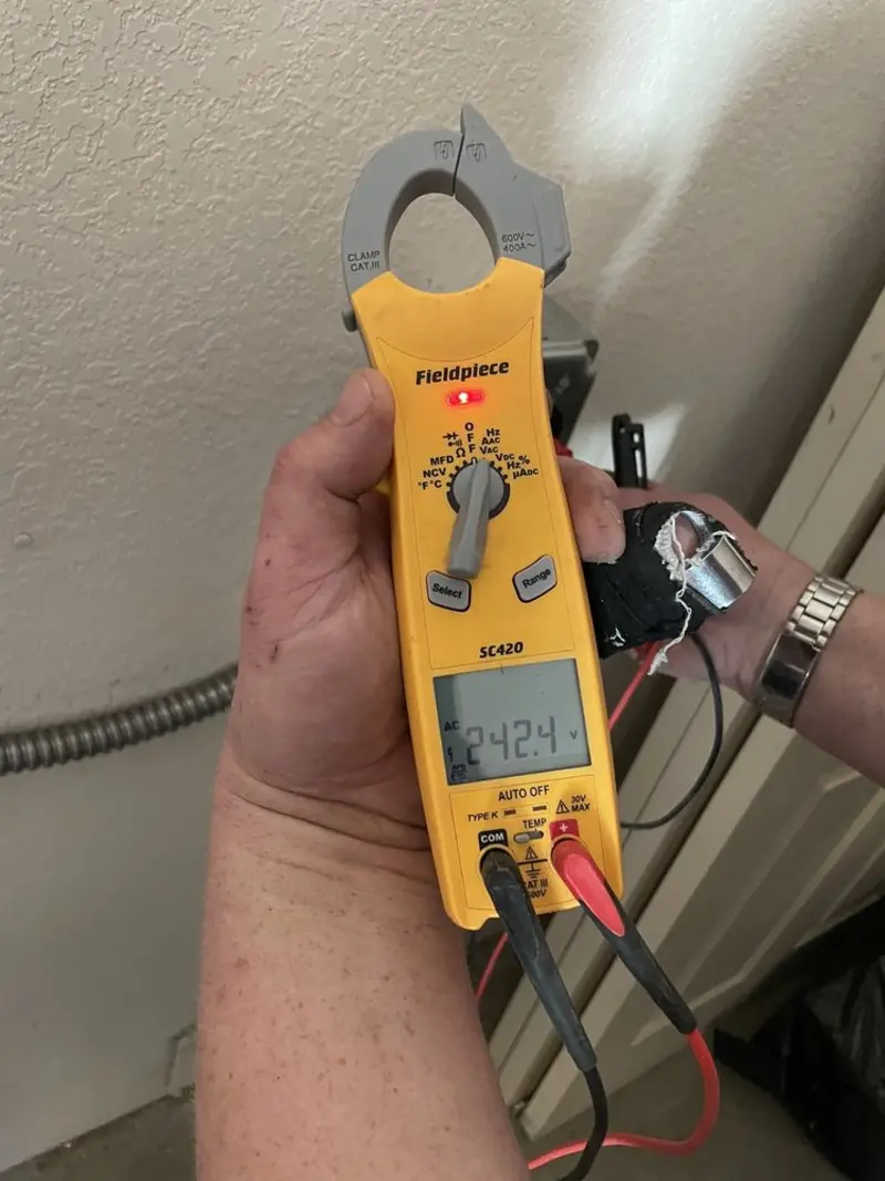 Voltage testing with clamp meter during Electrical Installation Services in Hampden